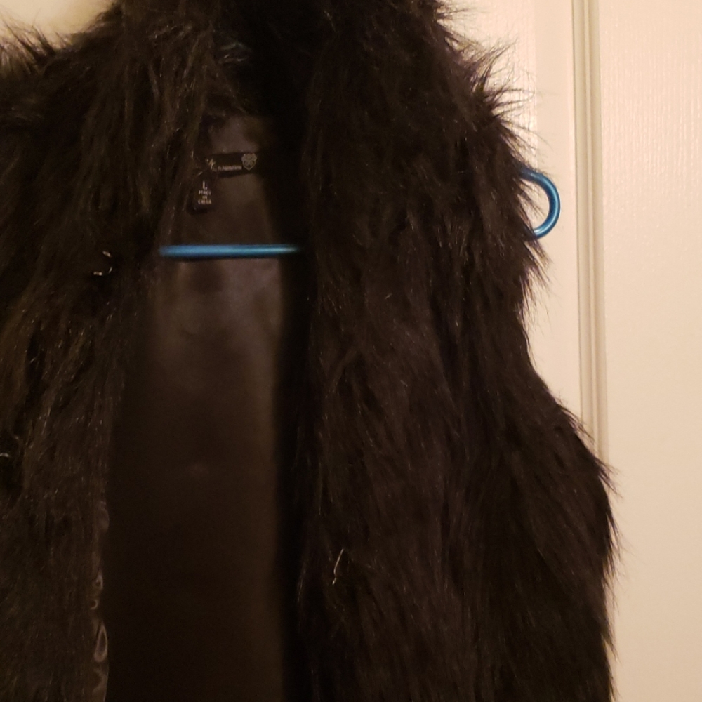Black faux fur vest.